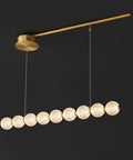 Modern Minimalist Magic Bean Chandelier With Nine Slick Brass Pendant Lights Adding Instant Vibe To Cool Cafes And Lounges While Delivering Top Notch Durability, with large globes and sleek design.
