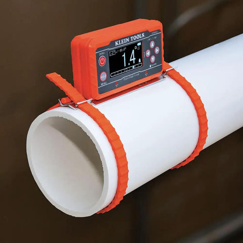 Digital Level And Angle Gauge Kit With Plumbers Straps Magnetic Base And Alarm For Pros attached to white pipe