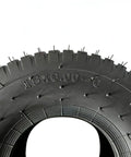 Close-up of Lawn Mower And Garden Tractor Tire 15x6.00-6 4 Ply Tubeless Non Highway Service showing tread and size marking.