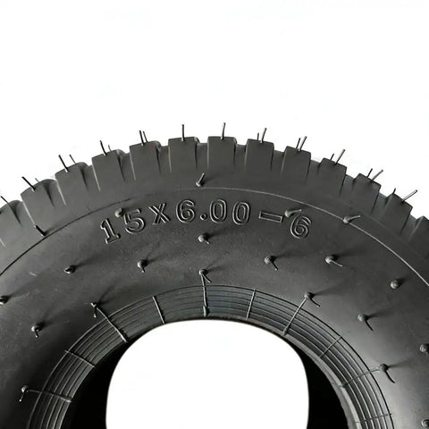 Close-up of Lawn Mower And Garden Tractor Tire 15x6.00-6 4 Ply Tubeless Non Highway Service showing tread and size marking.
