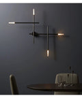 Modern Led Wall Sconce Crafted From Rust Resistant Metal With Soft Warm White Glow Designed For Any Room To Deliver Glare Free Illumination That Hits Different While Building A Super Chill Vibe on a dark wall above a table.