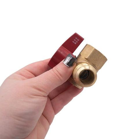 Hand holding Gas Connector Shut Off Angle Valve Five Eighth Inch OD Flare With Fifteen Sixteenth By Sixteen Thread To Three Quarter Inch