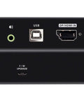 Rock Solid Fiber Optic KVM Extender Handles DisplayPort And HDMI For Flat Out True 4K Video Plus Complete Mouse Keyboard Control Up To Three Hundred Meters With Zero Sweat Setup; top and bottom view of KVM extender with ports.