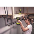 Woman using Hard Hitting 18V Brushless Drill And Impact Driver Kit With Two 1 5Ah Batteries Rapid Charger And Tough Nylon Case.