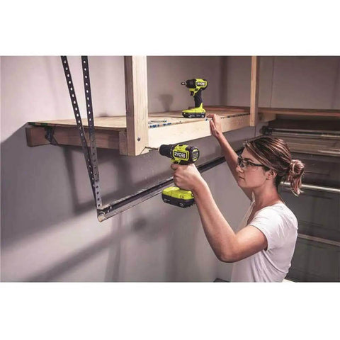 Woman using Hard Hitting 18V Brushless Drill And Impact Driver Kit With Two 1 5Ah Batteries Rapid Charger And Tough Nylon Case.