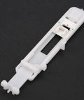 One Step Button Hole Press Foot For Home Sewing Machines Lightweight Durable Plastic keyhole attachment viewed from top angle.