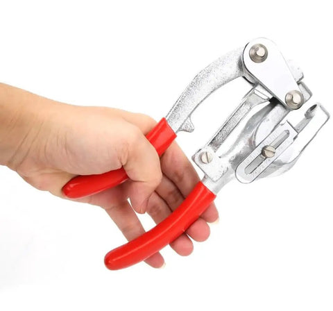 Hand holding Heavy Duty Sheet Metal Hole Punch Kit Hand Held Power Punch Set 3/32 Inch To 9/32 Inch with red handles and chrome steel body.