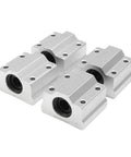 Four silver SC8UU ball bearing slides from the 8x200mm Linear Rail Shaft Kit 2Pcs With 4 Guide Supports And 4 SC8UU Ball Bearing Slides