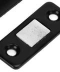 Heavy Duty Magnetic Cabinet Catch 8 Pack L Shaped Black Brackets With Strong Adhesive for Kitchen Doors Drawers and Cupboards No More Slamming close-up of a black metal magnetic plate.