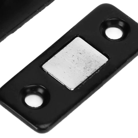 Heavy Duty Magnetic Cabinet Catch 8 Pack L Shaped Black Brackets With Strong Adhesive for Kitchen Doors Drawers and Cupboards No More Slamming close-up of a black metal magnetic plate.