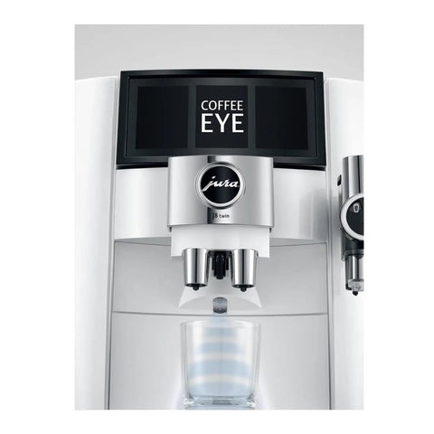 Top Shelf Automatic Espresso Coffee Maker With Dual Bean Hopper And Sweet Foam Milk Frother One Touch Brew White close-up of brewing unit with display.