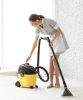 Woman using yellow vacuum with Replacement Vacuum Filter Bags For 10 To 14 Gallon Shop Vacs Type F 90662 9066200 and Type I VF2005