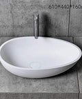Real Deal White Oval Vessel Sink Built Tough From Dense Artificial Stone For Quick Countertop Installation With A Slick Finish That Stays Bright Through Years Of Heavy Bathroom Traffic, 610x440x160mm.