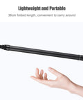 Carbon Fiber Selfie Stick With Telescopic Shaft Reaches Near Fifty Nine Inches For Killer Wide Shots and Smooth One Hand Control shown in folded 36cm length held in hand.