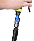 Hand using Blue 14 Piece Automotive Type C Coupler and Plug Kit With One Quarter Inch NPT Fittings Color Match System