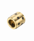 Top Shelf Brass Sleeve Bearings Three Pack Featuring Hella Smooth Graphite Bushings Eight Millimeter Bore By Fifteen Millimeter Diameter Self Lube Design showing a brass bushing with graphite holes.