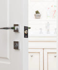Super Stylish Bothyi 2x Adjustable Ball Door Catches With Roller Beads Locks For Cupboard Gate And Closet Doors Black installed on a white door.
