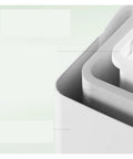 Close-up of Top Notch Countertop Ice Maker, showcasing compact white design and smooth edges for home RV camping use.