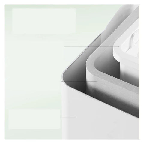 Close-up of Top Notch Countertop Ice Maker, showcasing compact white design and smooth edges for home RV camping use.