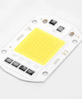 LED COB Chip Floodlight Bulb 20W 30W 50W 220V Input High close-up view of yellow COB chip on white PCB surface.