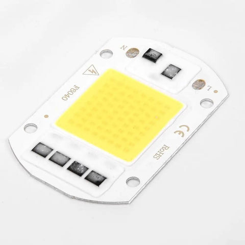 LED COB Chip Floodlight Bulb 20W 30W 50W 220V Input High close-up view of yellow COB chip on white PCB surface.
