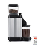 Side view of a Barista-Grade Coffee Grinder With 50 mm Flat Steel Burrs And Stepless Grind Size Dial, showing coffee beans and grinds.