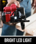Super Compact One Handed Cordless Circular Saw Kit With Four And A Half Inch Blade Brushless Motor 20V Lithium Battery and Charger shown with bright LED light.