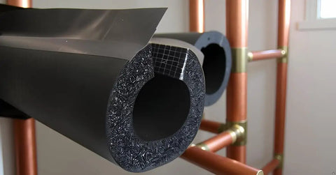 Rock Solid Premium Pipe Insulation Self Sealing Foam Rubber Tube close-up showing flexible black insulation for copper and PEX pipes.
