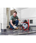 Heavy Duty 115 Volt Electric Conduit Bender Machine Featuring Autofeed And C45 Integral Wound Cable Designed To Bend Rigid Pipe Like Butter in use on a job site.