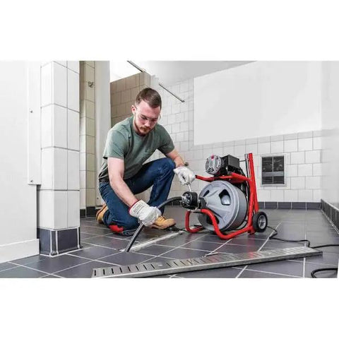 Heavy Duty 115 Volt Electric Conduit Bender Machine Featuring Autofeed And C45 Integral Wound Cable Designed To Bend Rigid Pipe Like Butter in use on a job site.