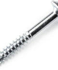 Close-up of a zinc pocket hole screw, 1-1/4 inch with fine thread and Maxi Loc head, ideal for hardwood and dense materials indoor use.
