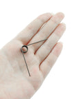 Holding a single torsion spring from 12 Piece Stainless Steel Torsion Spring Set For Tool Repair And Woodworking DIY 90 Degree Coil Small Springs