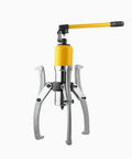No Bull Heavy Duty Hydraulic Gear Puller With Thick Steel Arms For Fast Wheel Bearing Removal And Smooth Hub Extraction, featuring a yellow handle and silver arms.