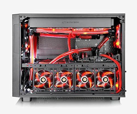 Front view of a black computer tower with red liquid-cooling tubes and four illuminated fans