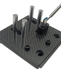 Close-up view of Must Have Carbon Fiber Welding Jig Wire Station With Pocket Hole For XT60 XT90 Connectors Soldering Clamp Craft Tool.