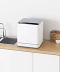 No Hookup Countertop Dishwasher That Sets Up In Minutes And Cranks Out Immaculate Loads Daily while placed on a kitchen countertop.
