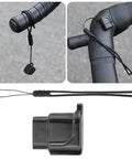 USB C Charging Adapter For Di2 Electronic Derailleurs Dope Charger For 12 Speed Shifting with black lanyard shown on bike.