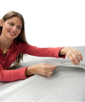 Woman adjusting Heavy Duty All Weather Car Cover Gonna Shield Your Tesla Model S Like Armor While Crushing Rain Snow And UV Damage
