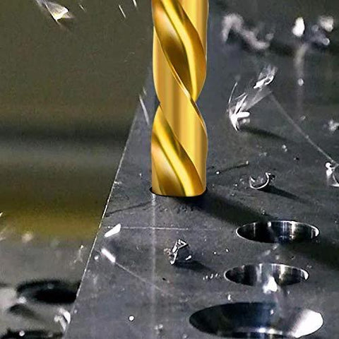 Titanium-coated drill bit drilling into metal plate; gold-colored, close-up view