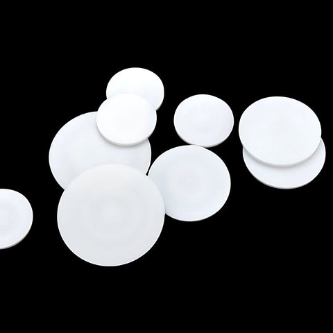 Set Of 10 White PTFE Round Discs, 40mm Diameter, 2mm Thick, Flat Sealing And Insulating Discs arranged on a black background