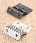 Two Pack 43 By 17mm Zinc Alloy Cabinet Door Hinges For Furniture Decor, antique bronze and silver finish on wooden surface.
