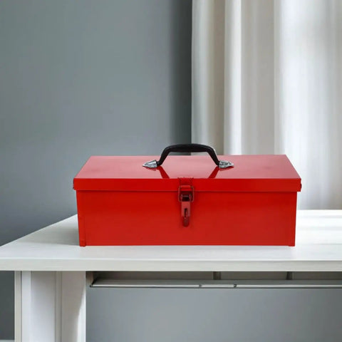 Slick Red Metal Toolbox Chest With Reinforced Carry Handle For Portable Gear Storage And Heavy Duty Tool Organization That Serves As The Ultimate Hardcore Hardware Locker on a table.
