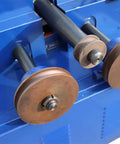 Close-up of Heavy Duty Electric Pipe Tube Bender Machine With 17 Die Set showing rollers for metal tube bending.
