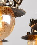 Close-up of Rustic Box Ceiling Pendant Light Badass Industrial Hanging Chandelier with amber glass and antique finish.