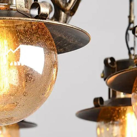 Close-up of glass globe from Killer Vintage Box Chandelier Pendant Light Fixture Offering Smooth Industrial Vibe Plus 115 Cm Width.