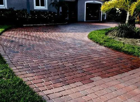 Curved patio of red and beige pavers showcasing high gloss shine after using Tough As Nails Silicone Concrete Sealer Gives A Knockout High Gloss Shine To Patios And Driveways Includes A Heavy Duty 5 Gallon Kit To Battle Road Salt Lock Sand In Place And Keep Surfaces Slip Resistant For Years.