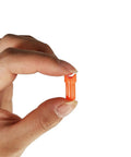 Half Moon Arrow Nocks 50 Pack Plastic Crossbow Nocks For 7.6mm ID Bolts Orange Replacement Tips held between fingers