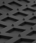Close-up of Built Tough Heavy Duty Trimmable Cargo Mat Liner with Deep Traction Grips in black rubber featuring textured surface.