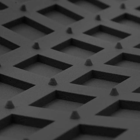 Close-up of Built Tough Heavy Duty Trimmable Cargo Mat Liner with Deep Traction Grips in black rubber featuring textured surface.