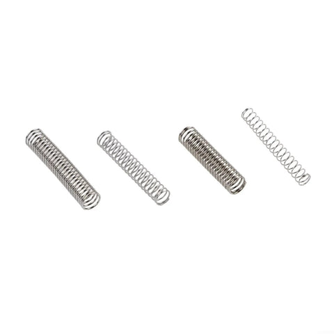Ultimate 300 Piece Compression Spring Assortment Kit With 23 Sizes Made From Tough 304 Stainless Steel For Any DIY, Auto Or Bike Repair Job In A Neat Storage Box You Will Love This Heavy Duty Set. Assorted stainless steel compression springs laid out on white